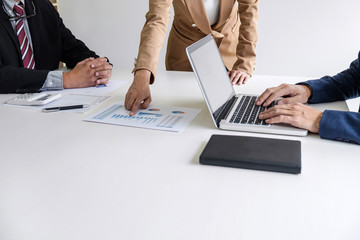 Teamwork process, Business team managers colleagues discussing and analysis new project investment plan, strategy in business profit, marketing documents report on table with laptop and tablet