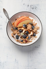 Bowl of granola with yogurt and fresh fruits