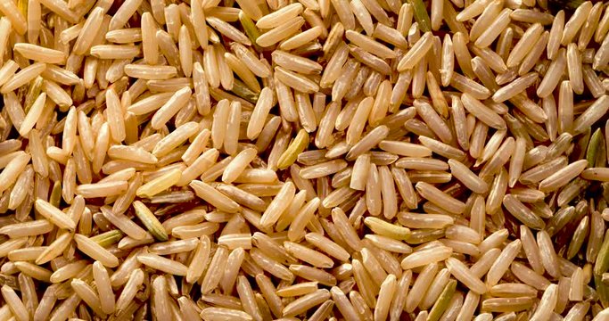 rotation of dry raw unpolished brown rice , 4k DCi resolution
