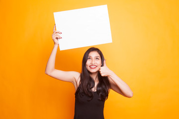 Young Asian woman show OK with  white blank sign.