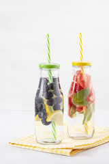 Herbs and fruits flavored infused water. Summer refreshing drink. Health care, fitness, healthy nutrition diet concept.