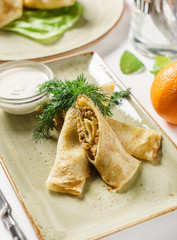 stuffed pancakes with sauce