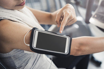 Young sport woman in gym using smartphone, Fitness ,training lifestyle concept