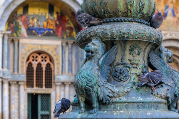 Lion of Saint Marc on a light fixture in front of Saint Mark's Basilica on Saint Mark's square in Venice Italy