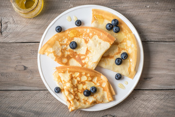 Crepes with blueberries and honey