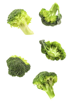 isolated broccoli falling on white background with clipping path