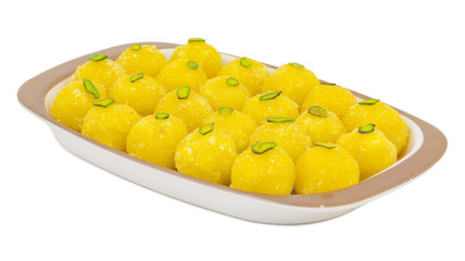 Indian Traditional Yellow Sweet Food Coconut Laddoo Also Know As Coconut Laddu, Ladoo, laddo Are Ball-Shaped Sweets. Isolated on White Background