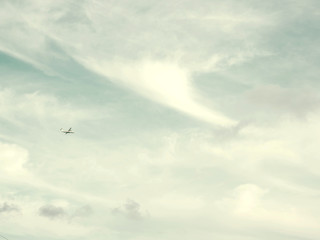 Fototapeta premium The plane flies against the sea