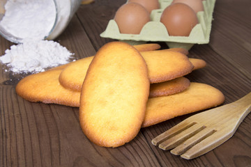 biscuits flour and eggs on wood