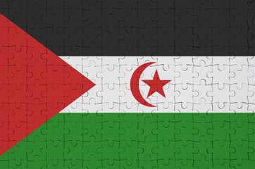 Western Sahara flag  is depicted on a folded puzzle