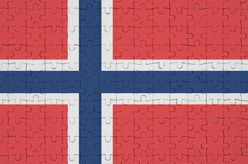 Norway flag  is depicted on a folded puzzle