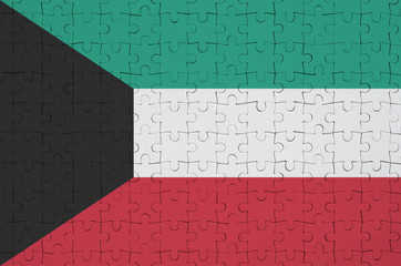 Kuwait flag  is depicted on a folded puzzle