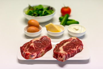 scotch fillet steak with other ingredients ready to cook a meal