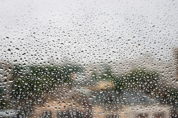 Rain drops on window glasses surface. Natural Pattern of raindrops