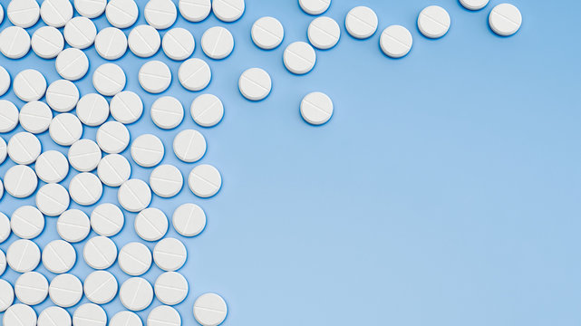 Pills on blue background