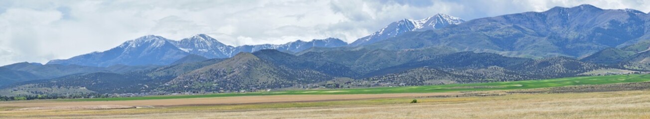 Panorama of Oquirrh Mountain range which includes The Bingham Canyon Mine or Kennecott Copper Mine, rumored the largest open pit copper mine in the world in Salt Lake Valley, Utah. USA.