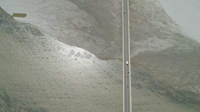 Modern bridge over river with cars in a mountain province Philippines,Luzon. Aerial view Bucao Bridge.