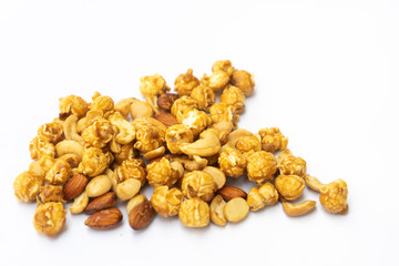 Popcorn and nut with caramel isolated on white background.