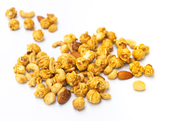 Popcorn and nut with caramel isolated on white background.