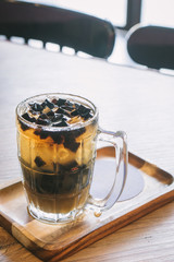 Thai dessert is black grass jelly in glass.