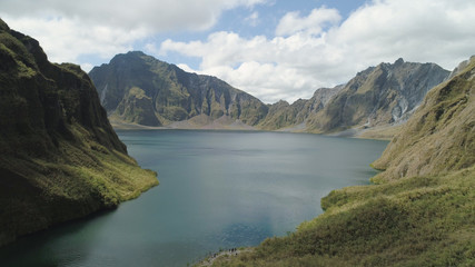Crater lake of the volcano Pinatubo among the mountains, Philippines, Luzon. Aerial view beautiful landscape at Pinatubo mountain crater lake. Travel concept