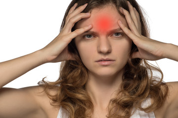 Young girl experiencing headache or depression and mourned over white background