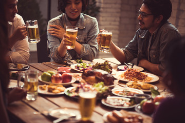 People in asian are celebrating the festival they clink glasses beer and dinner happy