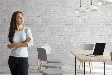 Woman in meeting room with laptop