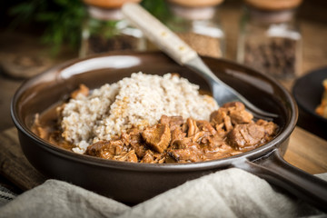 Barley groats with stewed meat.
