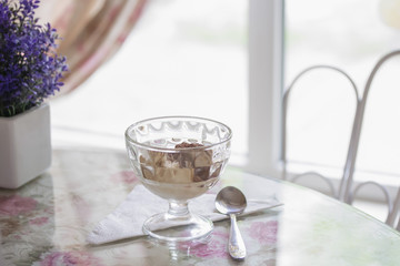 one glass of dessert cold ice cream in a cafe on the table