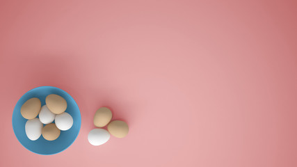 Chicken eggs into a blue cup on the table, pink background with copy space, breakfast easter food concept idea, top view