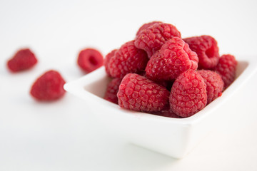 Raspberries on white background