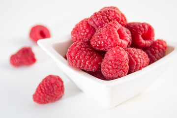 Raspberries on white background