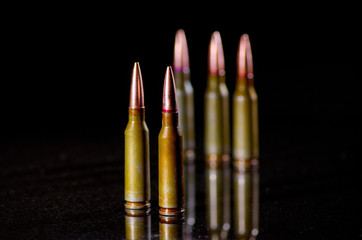 Ammunition cartridges on black