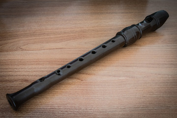 Flute on wooden background © alisandro81