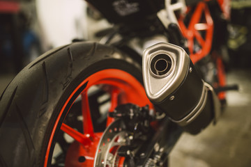 Obraz premium Detail of the exhaust pipe of a motorbike