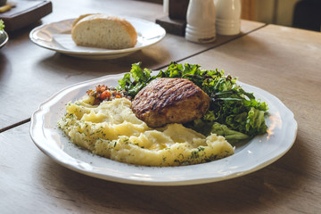 Meat, potatoes, lettuce and chiabata