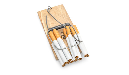 Closed mousetrap with cigarettes on white. Top view.
