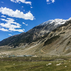 Fototapeta na wymiar mountain on blue sky with clouds background in Kashmir , India