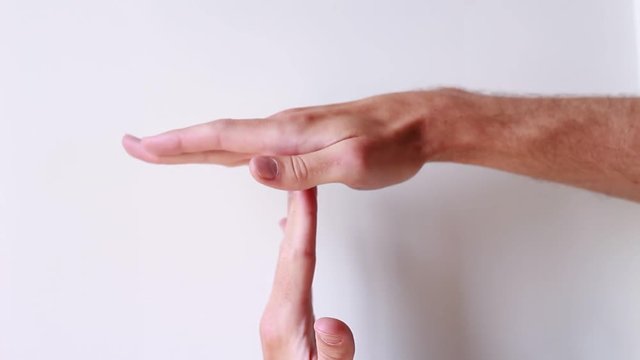 Time out gesture. Male hands on white background