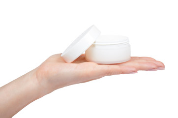 Clean cream bottle with hand isolated on white background