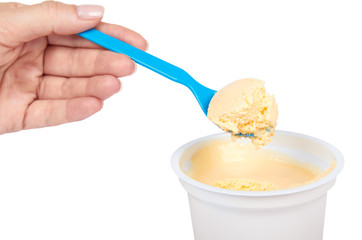 Fototapeta na wymiar Yogurt cream in container with hand isolated on white background