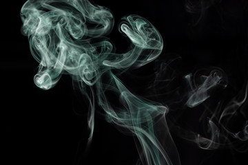 Make smoke from incense.  Black background