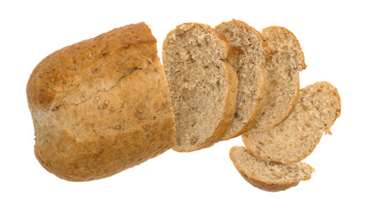 Top view of a small whole wheat bread loaf with slices isolated on a white background.