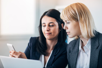 Colleagues working in office