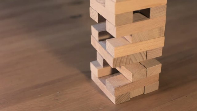 Jenga falls on the table, the tower falls.