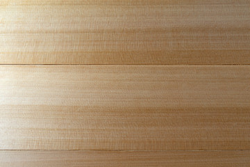 Close view of polyurethane coated western red cedar boards.