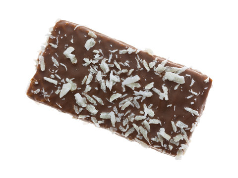 Top view of a single chocolate wafer with coconut flakes cookie isolated on a white background.