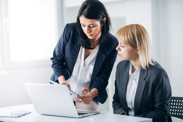 Colleagues working in office
