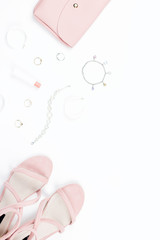 Fashion accessories, make up products, sandals and handbag on white background. Beauty and fashion concept, flat lay